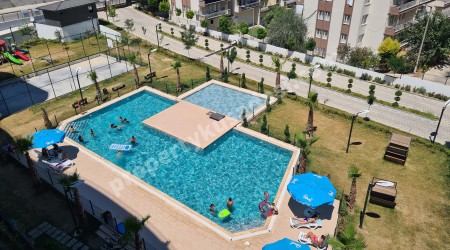 КОМФОРТНЫЕ АПАРТАМЕНТЫ 3+1 В ЖИЛОМ КОМПЛЕКСЕ С БАССЕЙНОМ В КУШАДАСЫ.