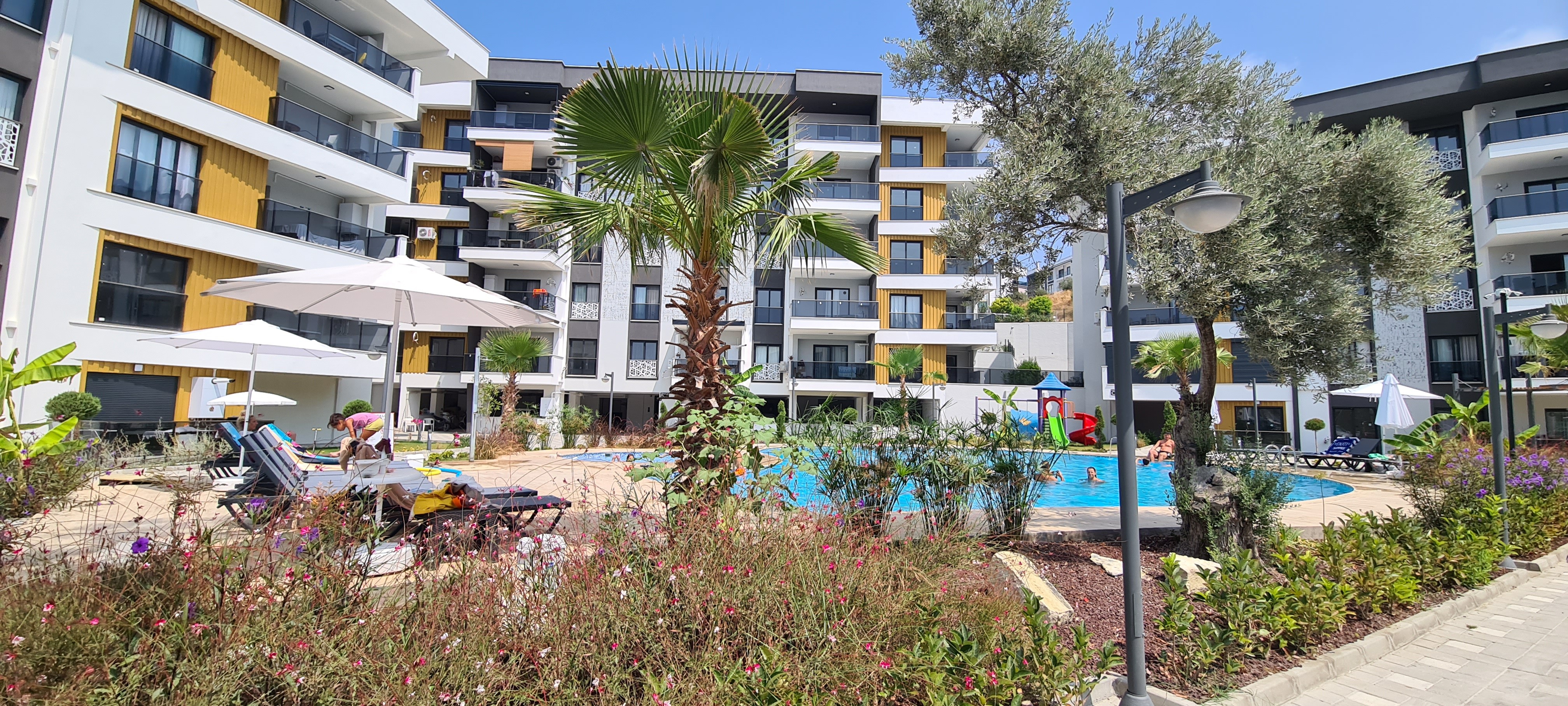 FOR SALE IN KUŞADASI | PRIVATE GARDEN 2+1 | 75 SQM | 50 SQM GARDEN & TERRACE | INDOOR & OUTDOOR POOLS