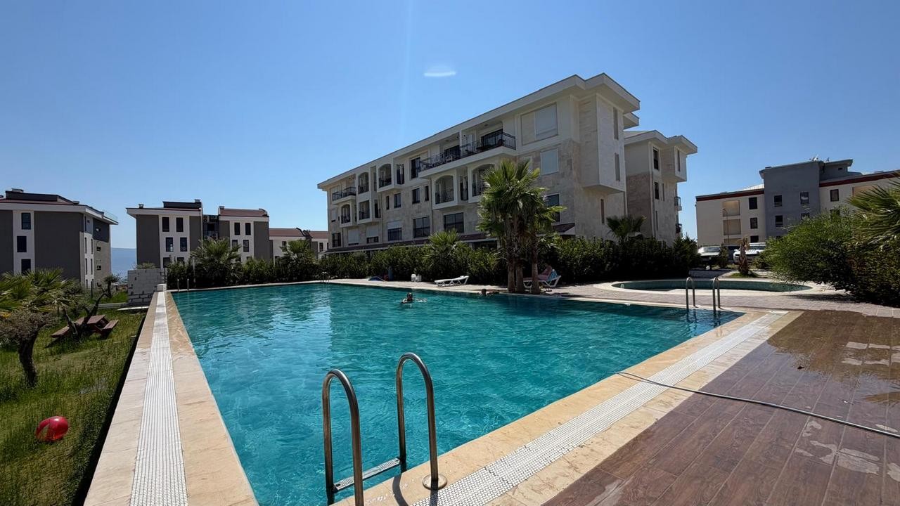 3+1 APARTMENT FOR SALE WITH MOUNTAIN AND POOL VIEWS IN DEĞİRMENDERE, KUŞADASI